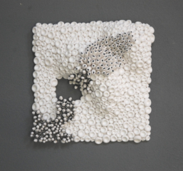 square clay textured wall sculpture in black and white, textures of the sea creating a seascape panel ideal for interior design.