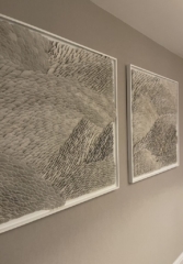 sculptural clay wall panels diptych in cream color with white frames, shapes come out of the frame at various angles creating a wave pattern, much like a calm ocean with gently lapping waves. Highly tactile and textured wall art ideal for interior design projects, hotels or public spaces.