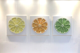 zesty fruit textured string wall art triptych for modern interiors, showing lemon, lime and orange slices.
