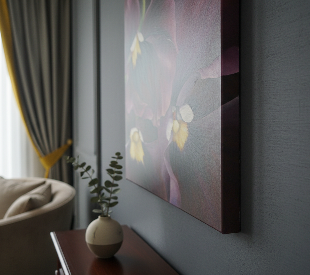 A side view of a painting of pansies on a thick gallery wrap canvas. The sides of the canvas are painted to match the painting. The painting is displayed in a luxurious interior, and the shot is a close-up, emphasizing the texture of the canvas and the depth of the painting. The dimensions are 100x80cm, with careful attention to scale.