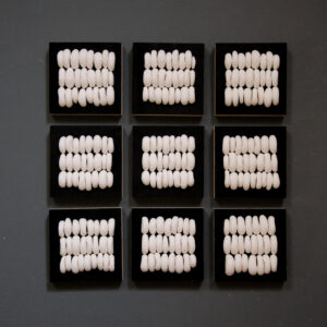 abstract dimensional wall art on wood blocks in black and white