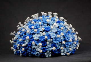 Forget Me Not Sculpture in blue and white or blue and yellow as client prefers, abstract flowers where the hearts emerge from the flower and stick out making it super tactile. Originally designed in support of Ukraine to raise money for medical supplies.