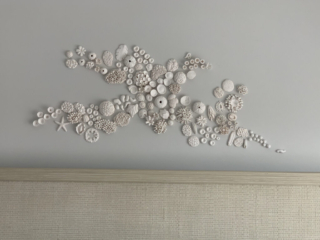 clay coral reef above bed containing 135 different elements to resembles textures of the sea, all hand-sculpted in matte white clay, commissions welcome
