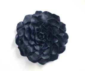 Navy Blue Wall Flower created in clay, many delicate petals.